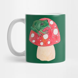 Green frog on red mushroom fly agaric Mug